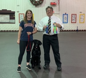 Professional Dog Trainer, McKenzie with her obedience title-winning pup, Gus!